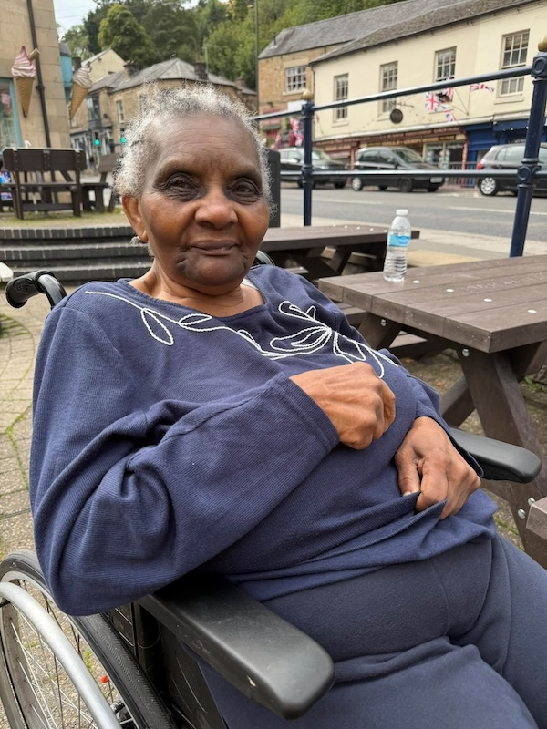 resident in wheelchair smiling
